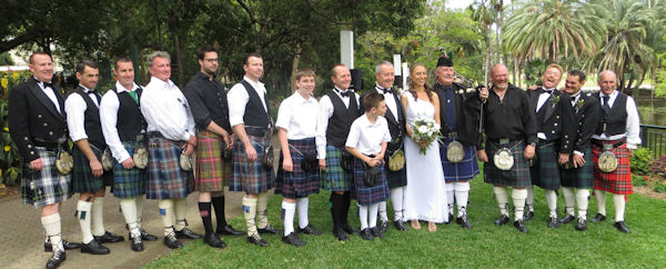 Bride with all the men
                    in kilts - Brisbane Botanic Gardens, Jennifer Cram,
                    Brisbane Wedding Celebrant