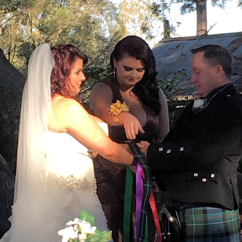 Handfasting using a tartan band plus coloured
ribbons