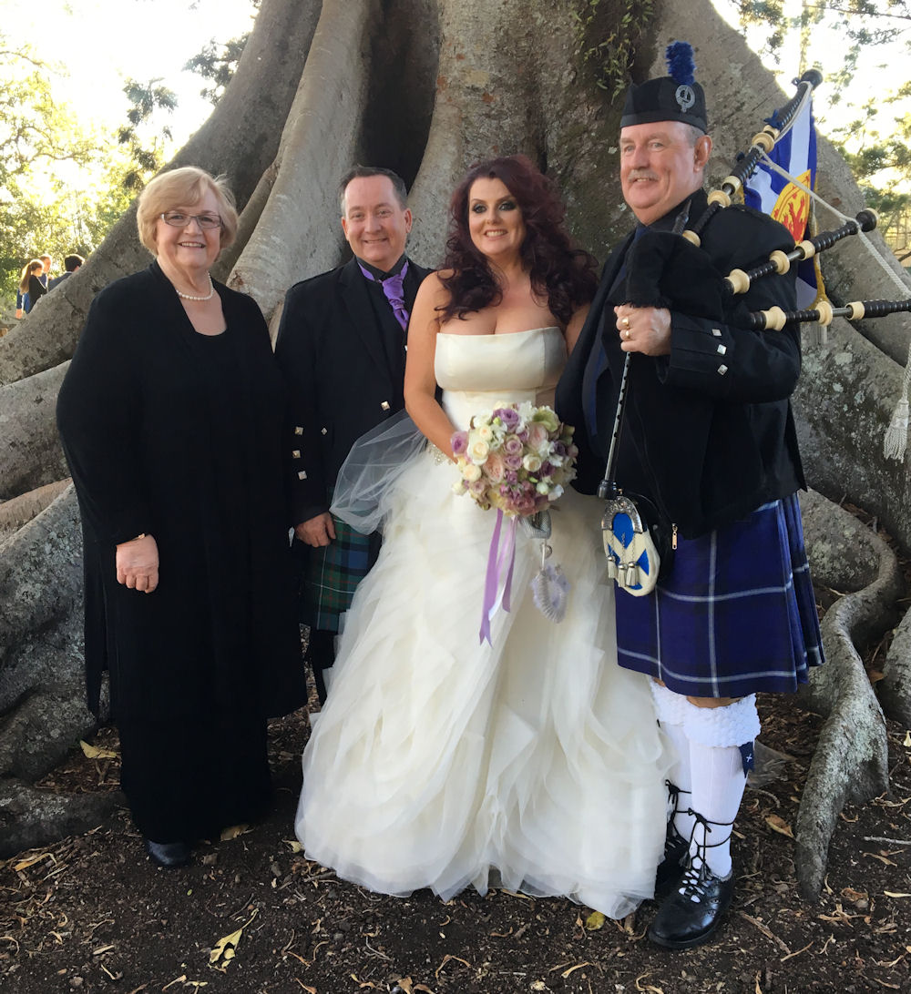 Jennifer Cram with couple and Piper Joe after
their Handfasting wedding at Old Petrie Town