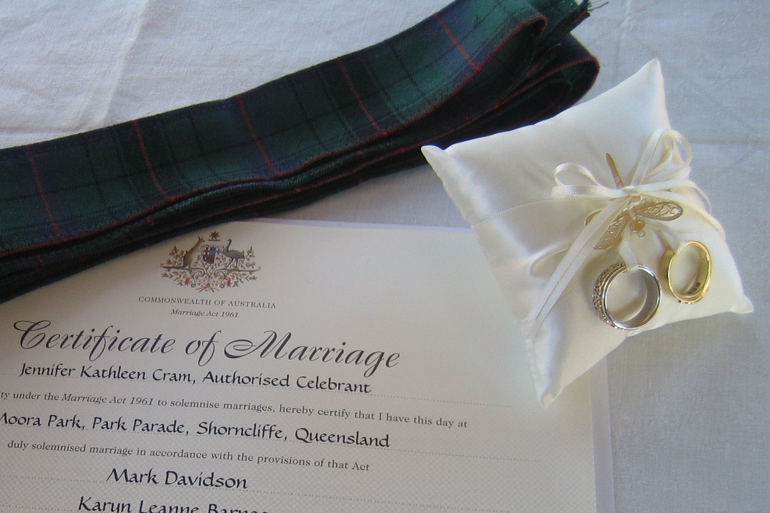 Tartan Handfasting Band with wedding rings on a
pillow